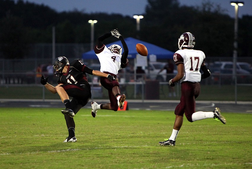 Riverviewâ€™s Myles Merrick, No. 4, and Braden Riverâ€™s Erik Ross, No. 11, fall backwards as they attempt to get the ball.