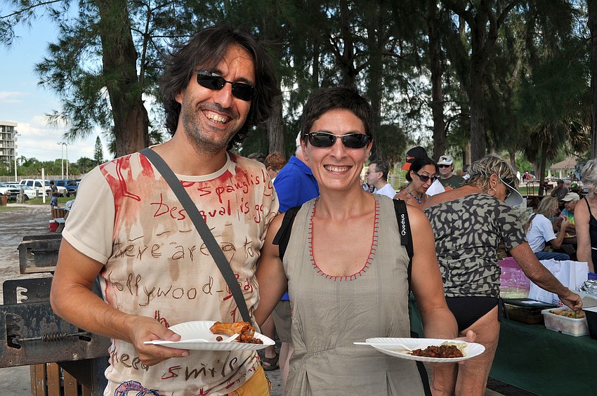 Eduardo Fernandez and Marta Estremera filled up their plates with food Sunday, Oct. 14, at the WSLR Beach Bash.