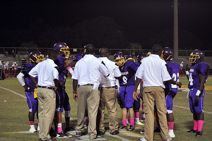 Booker strategizes during a time out.
