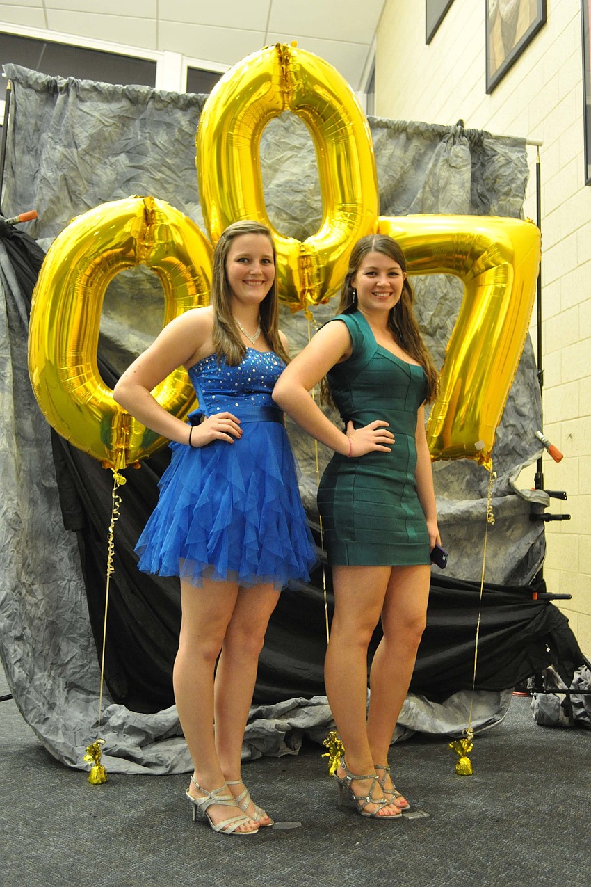 Audra Pack and Natalie Rodriguez, both seniors, made sure to have their James Bond-themed photo taken at the Homecoming Dance Oct. 20.