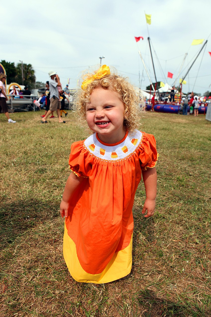 Cami Rash, 2, wore her candy corn dress to the Sarasota Pumpkin Festival.