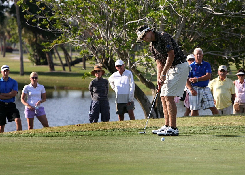 Jhared Hack makes his final putt on the 18th hole.