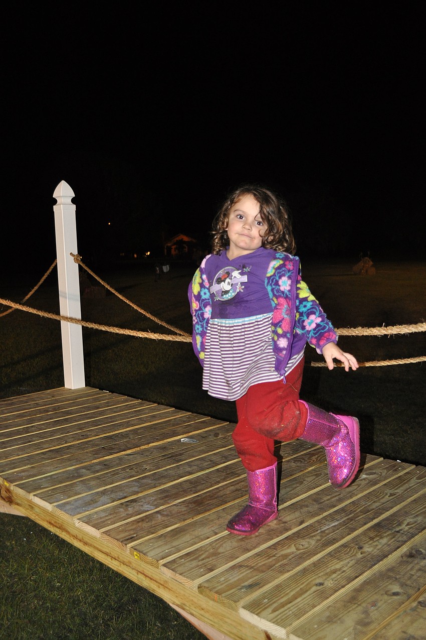 Madison Ricardo stood on a bridge.