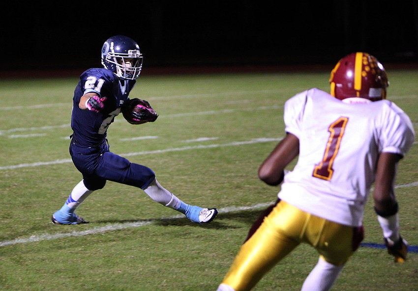 Austin Hoppe, No. 21, prepares to make his way up the field with the ball.