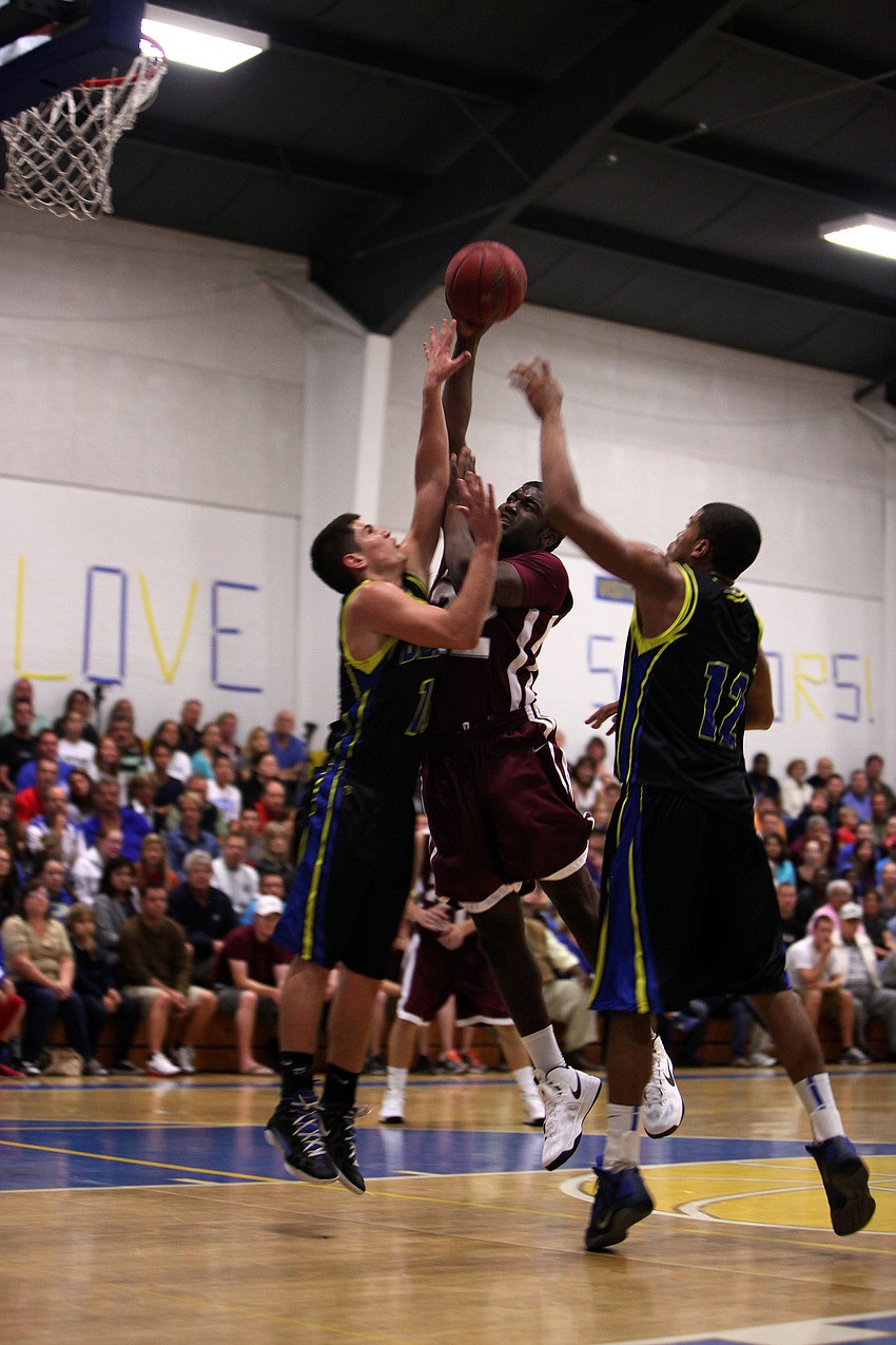 Jeremiah Henderson, No. 22, attempts to during Tuesday nightâ€™s game.