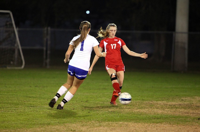 Cardinal Mooneyâ€™s Emily Brown, No. 17, tries to keep the ball away from Sarasota Christianâ€™s Anna Cecelia Genson, No. 1