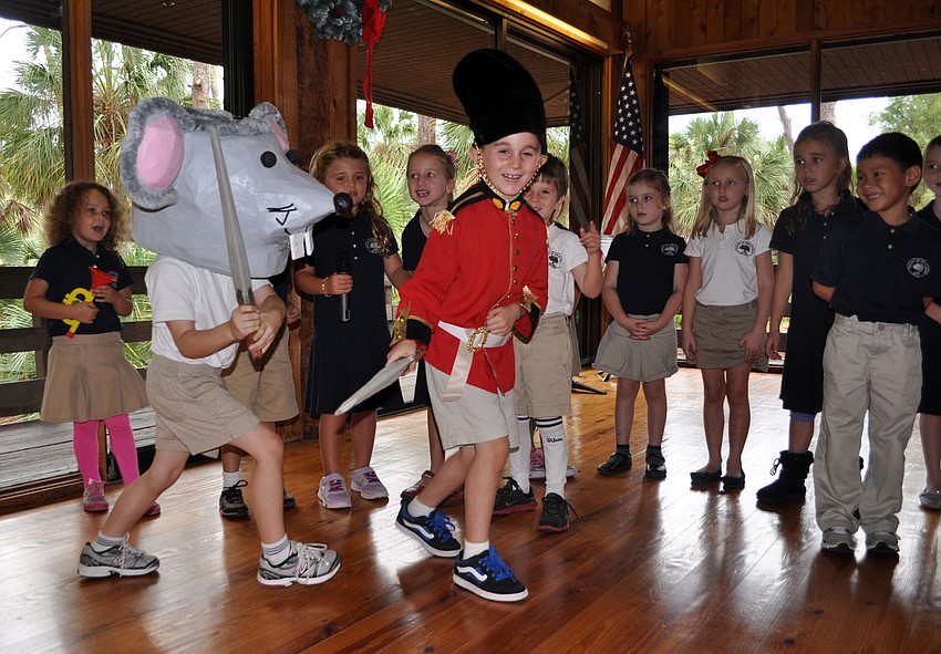 P.J. Svilokos and Aiden White battle during â€œMarch of the Toysâ€, sung by the Kindergarten Chorus, as a toy soldier and the Mouse King.