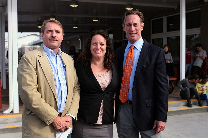 Devin Rutkowski, principal Tara Tahmosh and Larry Eger