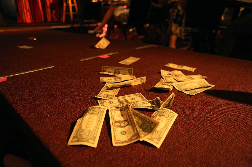Many women threw dollar bills at the bachelors as they strutted their stuff on stage Tuesday, Sept. 18 during the third annual BYOBachelor Auction at McCurdyâ€™s Comedy Theatre.