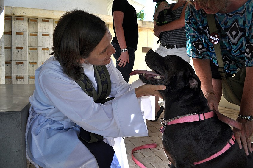Associate Rector Andi Taylor blesses Baby, 6, during the Animal Blessing Sunday, Sept. 30 at St. Boniface Episcopal Church.