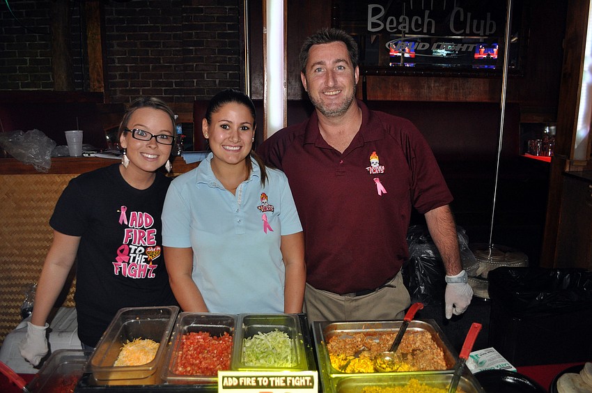 Amanda Sobojinski, Kelly Mortazavi and Keith Spelman from Tijuana Flats catered the Cure Cara fundraiser Thursday, Oct. 4.