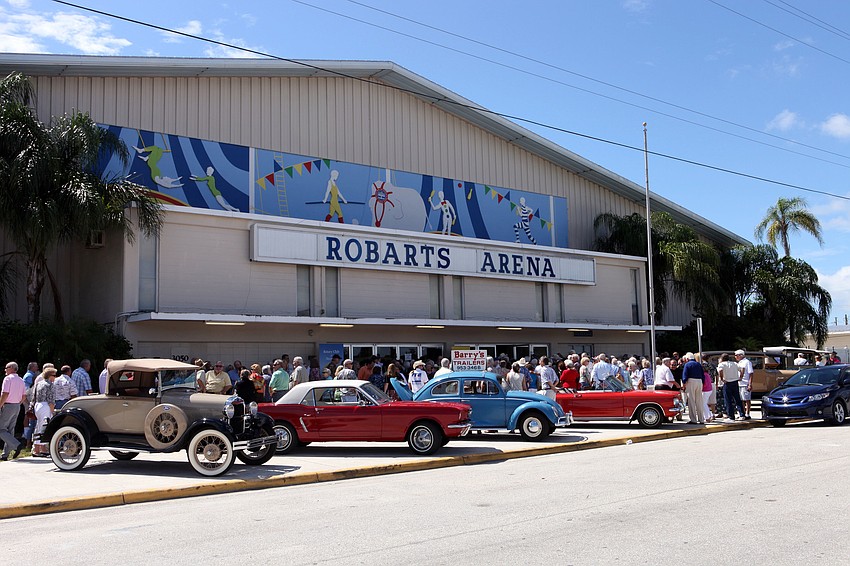People wait in line to get inside for the 38th annual â€œPioneer Dayâ€ Picnic at Robarts Arena Sunday, Oct. 7. A variety of vintage cars were displayed out front for people to look at and reminisce over.