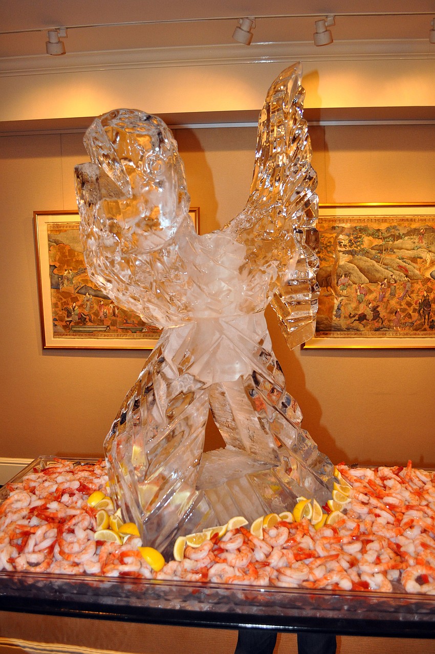 An oversized ice sculpture of a piece of shrimp was the centerpiece of the shrimp buffet.