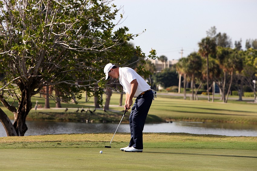 Sean Jacklin putts his ball into the hole for an Eagle on the 18th hole.