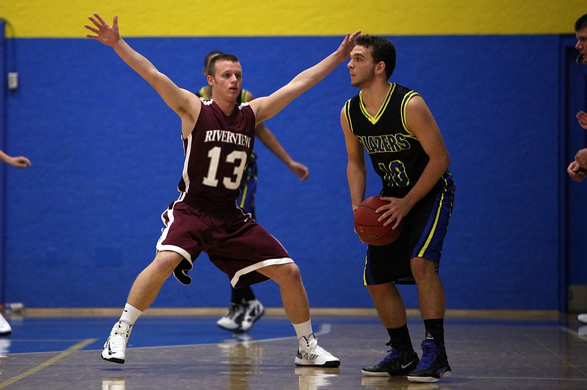 James Robustelli, No. 13, tries to block Quinton Sommers, No. 10.