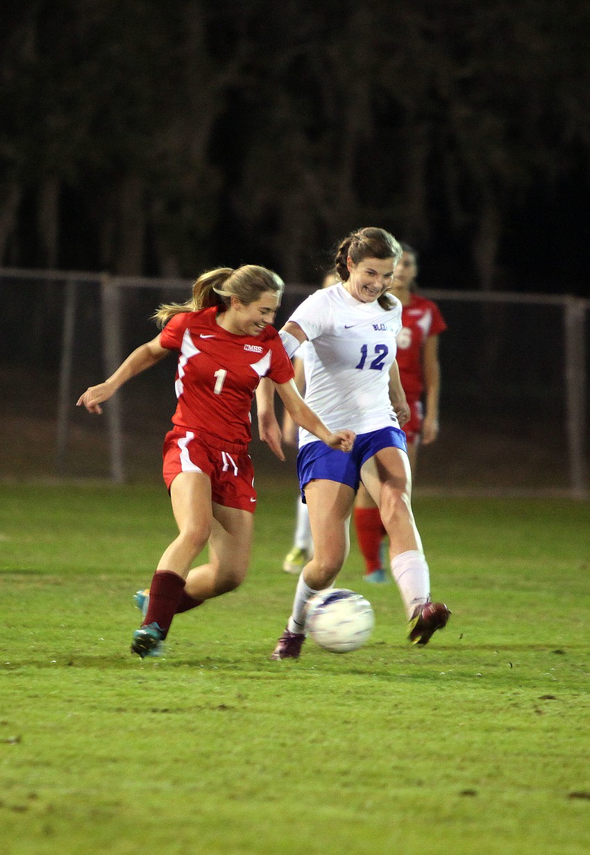 Cardinal Mooneyâ€™s Anna Brusco, No. 1, and Sarasota Christianâ€™s Kelsey Murphy, No. 12, both go after the ball.