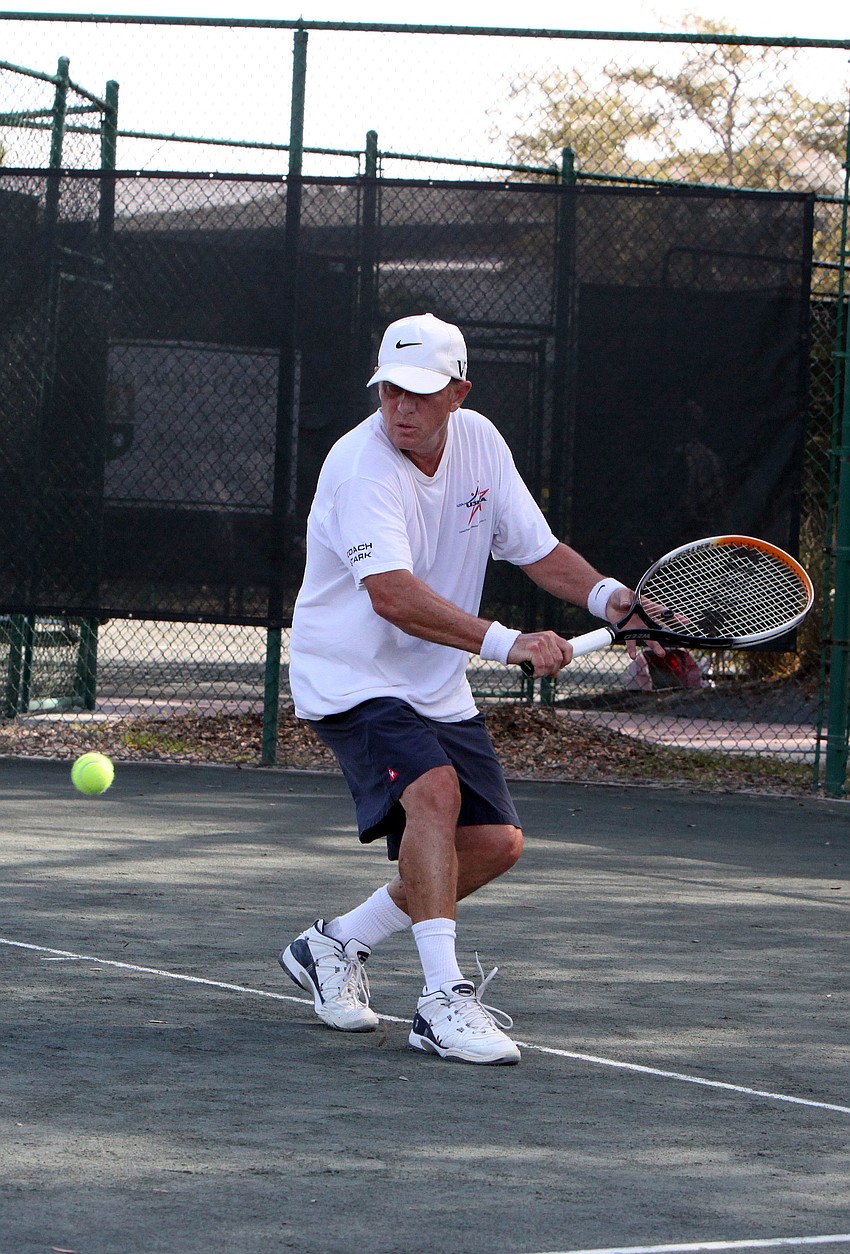 Bob D. Boldmon prepares to hit a backhand Tuesday, Nov. 27, during the Longboat Key Senior Clay Courts tournament at the Longboat Key Public Tennis Center.