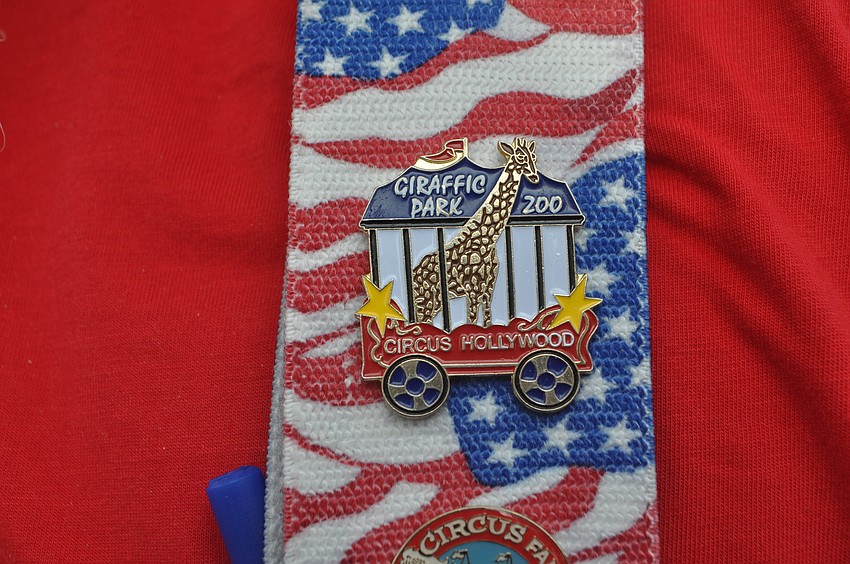Ron Vedder shows off his Giraffic Park Zoo pin from Veniceâ€™s Circus Hollywood.