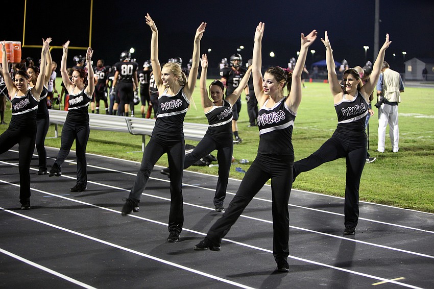 The Braden River dance team girls perform to songs played by the band on the sidelines Friday, Sept. 21