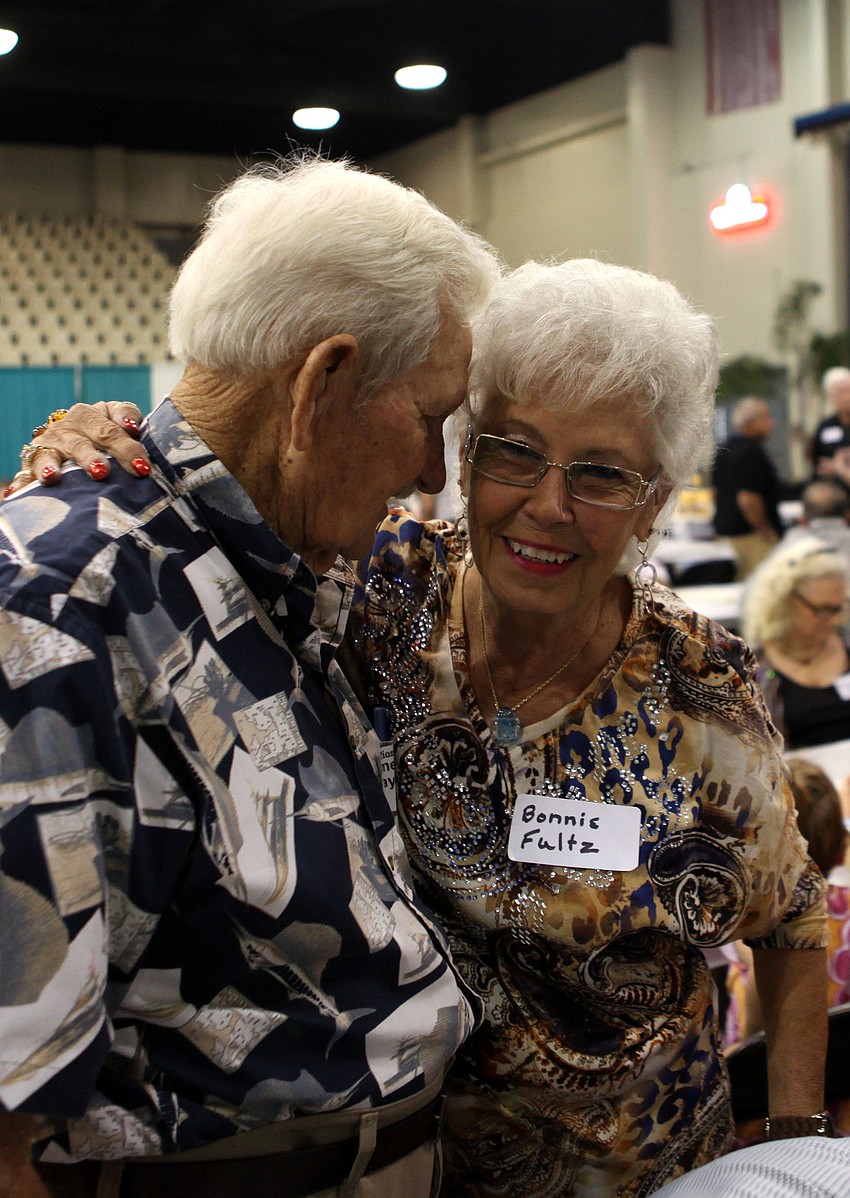 Elmer C. Taylor and Bonnie Fultz greet one another with hugs and smiles Sunday, Oct. 7, at Robarts Arena.