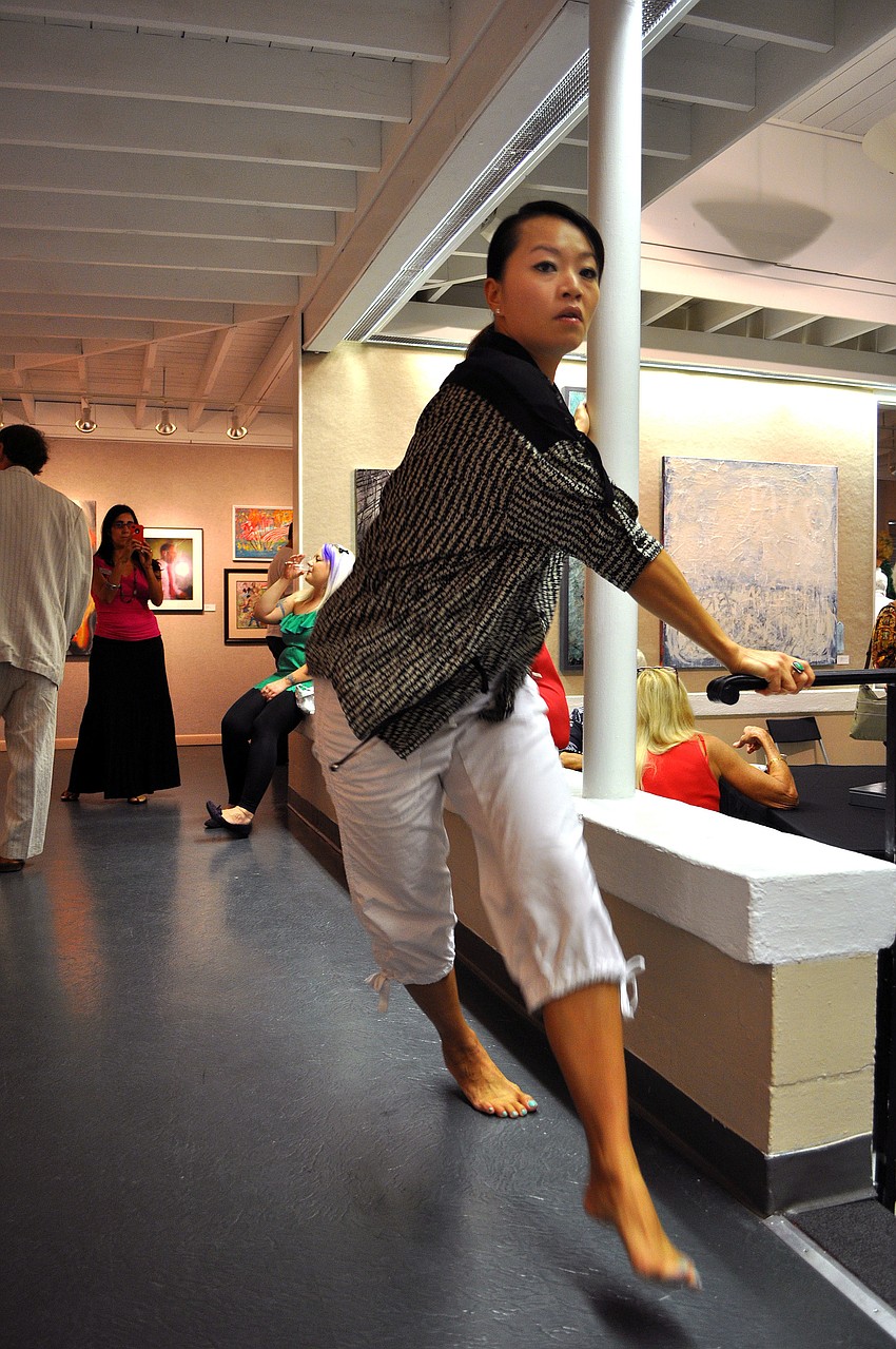 Xuan Yang dances around the Itâ€™s Political! exhibit Thursday, Oct. 18, at Art Center Sarasota.