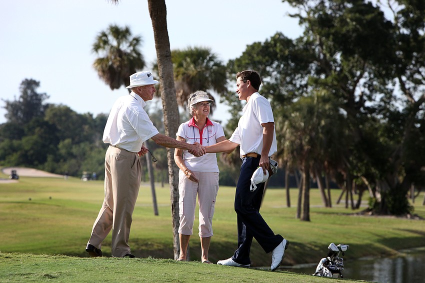 Tommy and Helen Horton congratulate Sean Jacklin on how well he played.