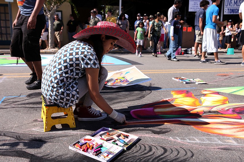 Adry del Rocio wore a sombrero to keep the sun off of her while she worked Saturday, Nov. 3, on Pineapple Avenue.
