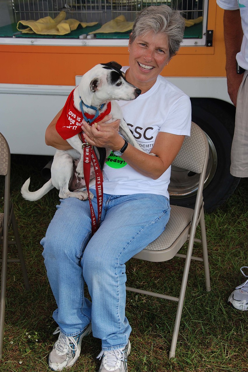Joyce D'Angelo of the Humane Society of Sarasota County cuddles her jack Russell mix, Sky.