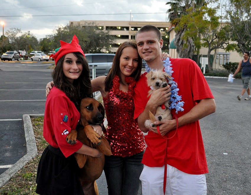 Janeen Pilafian, Carissa Barnes and Jordan Lee with their dogs, Brandy Michelle and Nyla.
