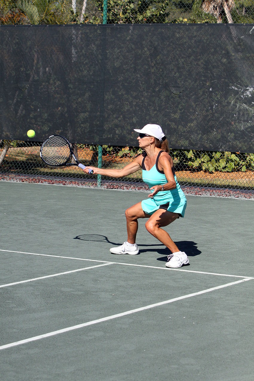 Emme Shapiro bends down low to get the ball.