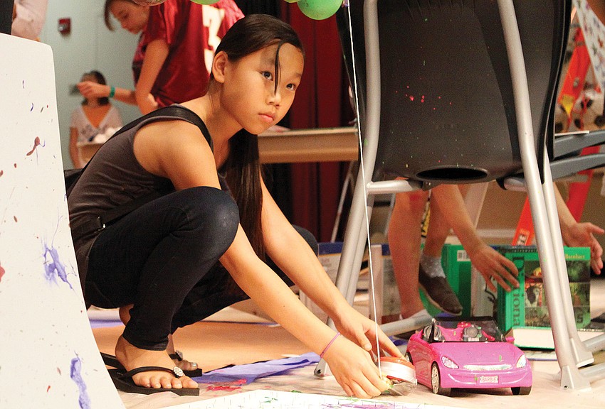 Grace Menke, 10, set up her groupâ€™s, â€œEpicly Easy,â€ Rube Goldberg type of project at Southside Elementary Schoolâ€™s fourth annual Science Night.