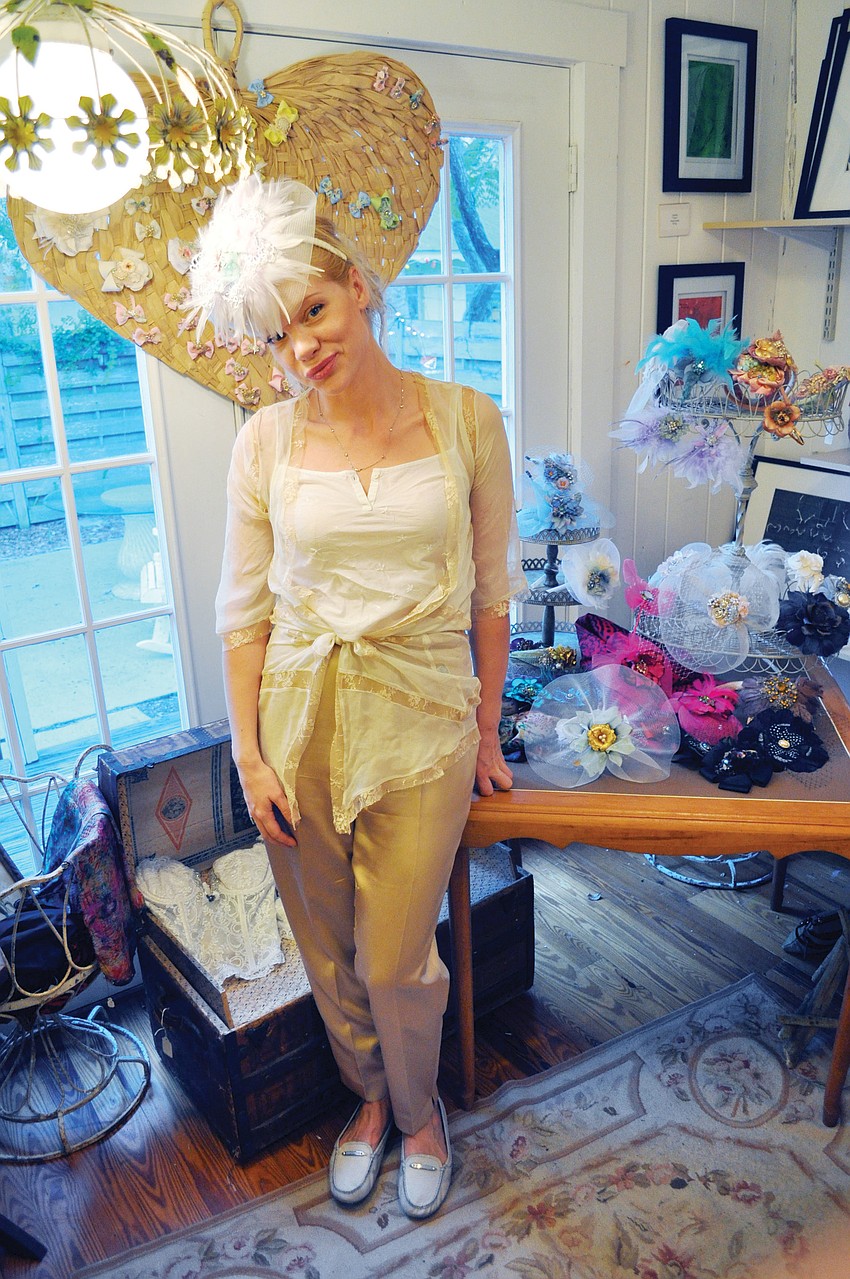 Daniella Landelius showed off one of her decorative hats at the monthly Towles Court art walk.