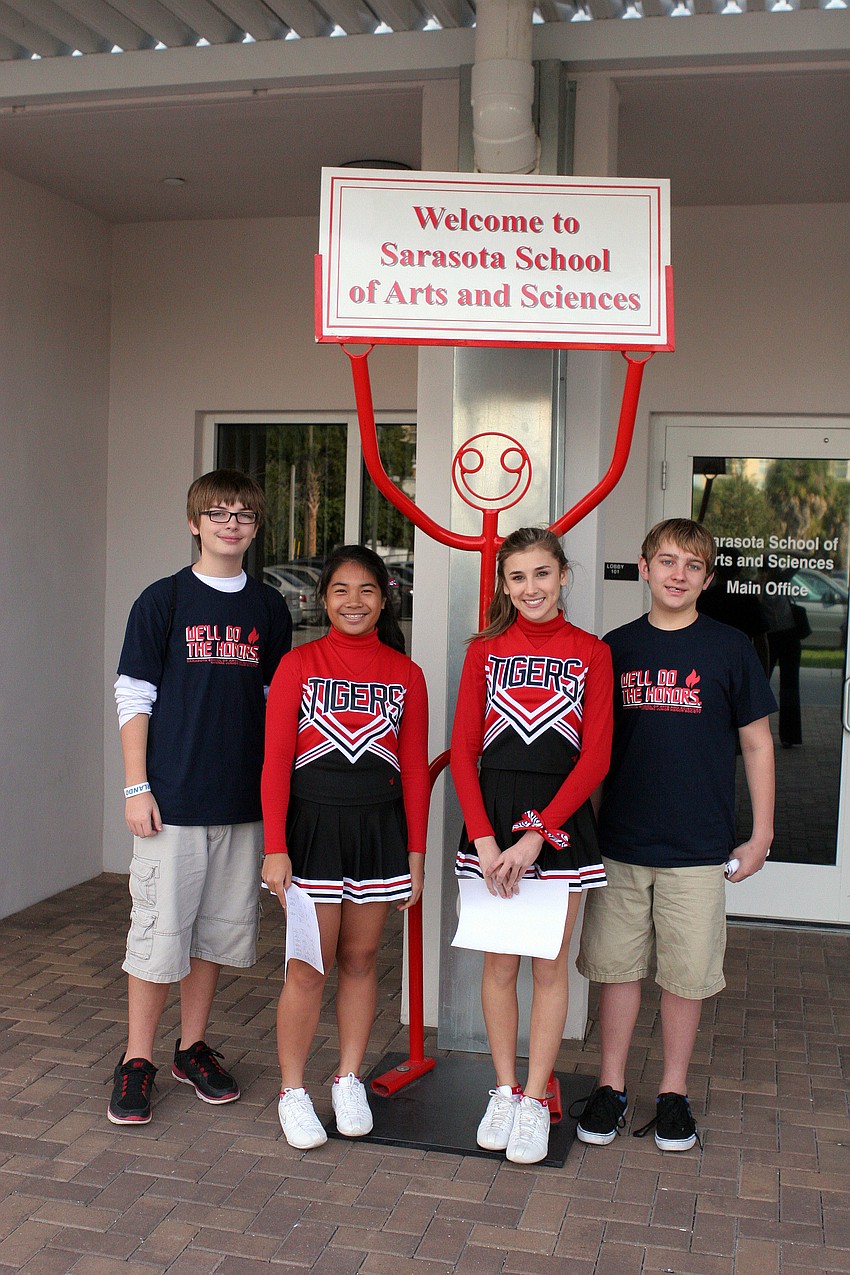 Tanner Pack, 14, Mikaela Vitug, 14, Sabrina Weaver, 13, and Jason Korwin, 12, helped give tours of the school.