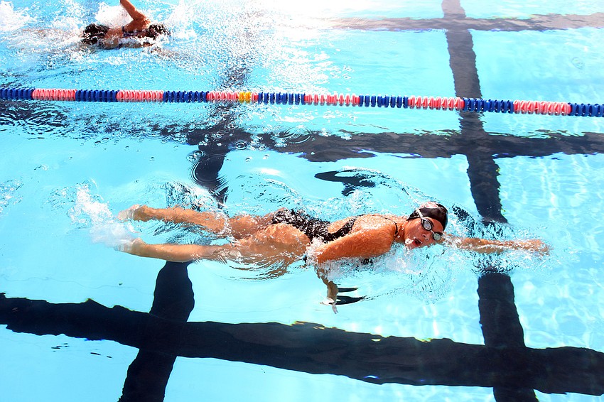 Alison Ruzbacki, 10th grade at Riverview High School, does the breaststroke during one of her swimming events.
