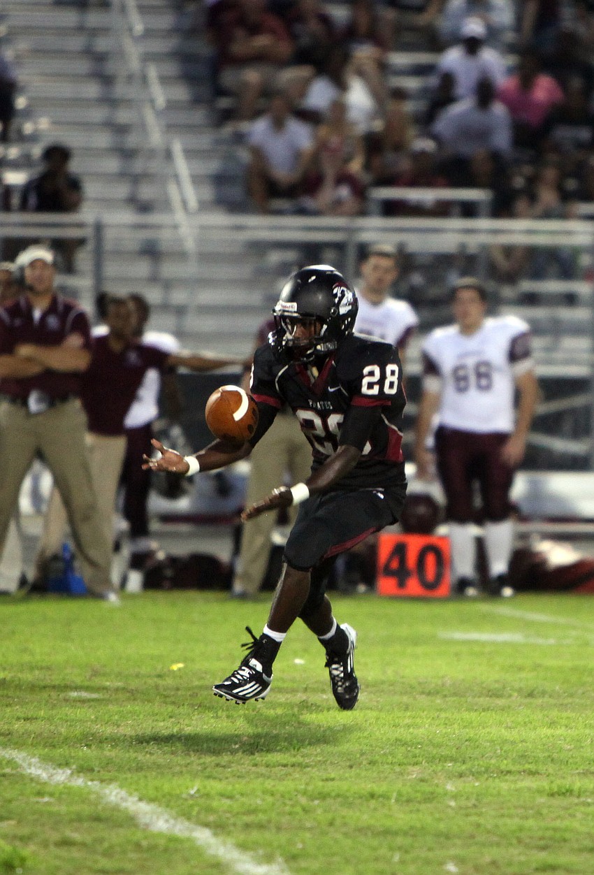 Caleb Ford, No. 28, catches the ball.