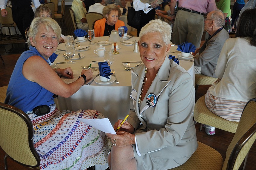 Liz Yerkes and Lillian Sands fill out some paperwork Tuesday, October 9, at the Longboat Key Democratic Club luncheon at the Longboat Key Harbourside Dining Room.