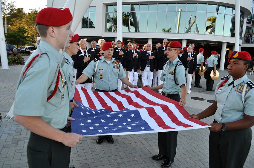 Sarasota Military Academy students hold the flag after bringing it down during the Change of Watch ceremony Saturday, Oct. 20.