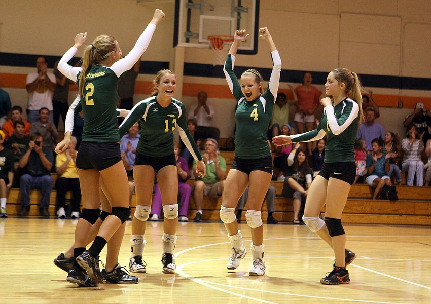 St. Stephenâ€™s lady volleyball players rejoice on the court after they realize they have won the game.