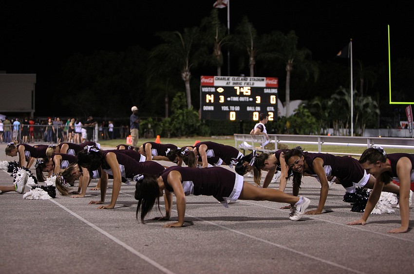 The Riverview cheerleaders do pushups after the Rams scored Friday, Oct. 26, during the Riverview High School versus Sarasota High School football game.