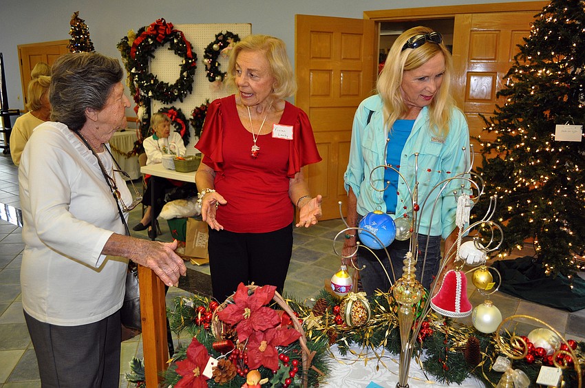 Jeanette Schoner, Vivian Leahy and Barbara Jendrysik talk about Christmas decorations.