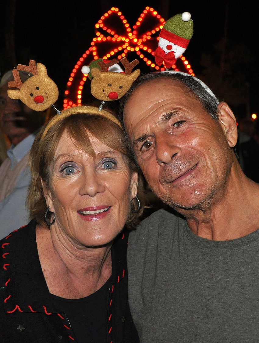 Mary and Joe Moccia wore festive headbands Friday, Dec. 7, at the Holiday Night of Lights on St. Armands Circle.
