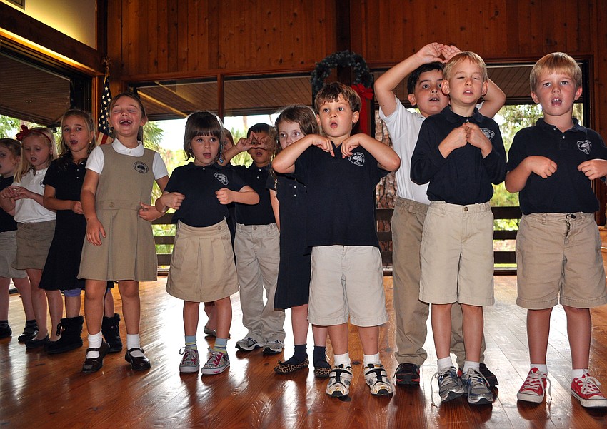 The Kindergarten Chorus sing to â€œFeliz Navidadâ€.