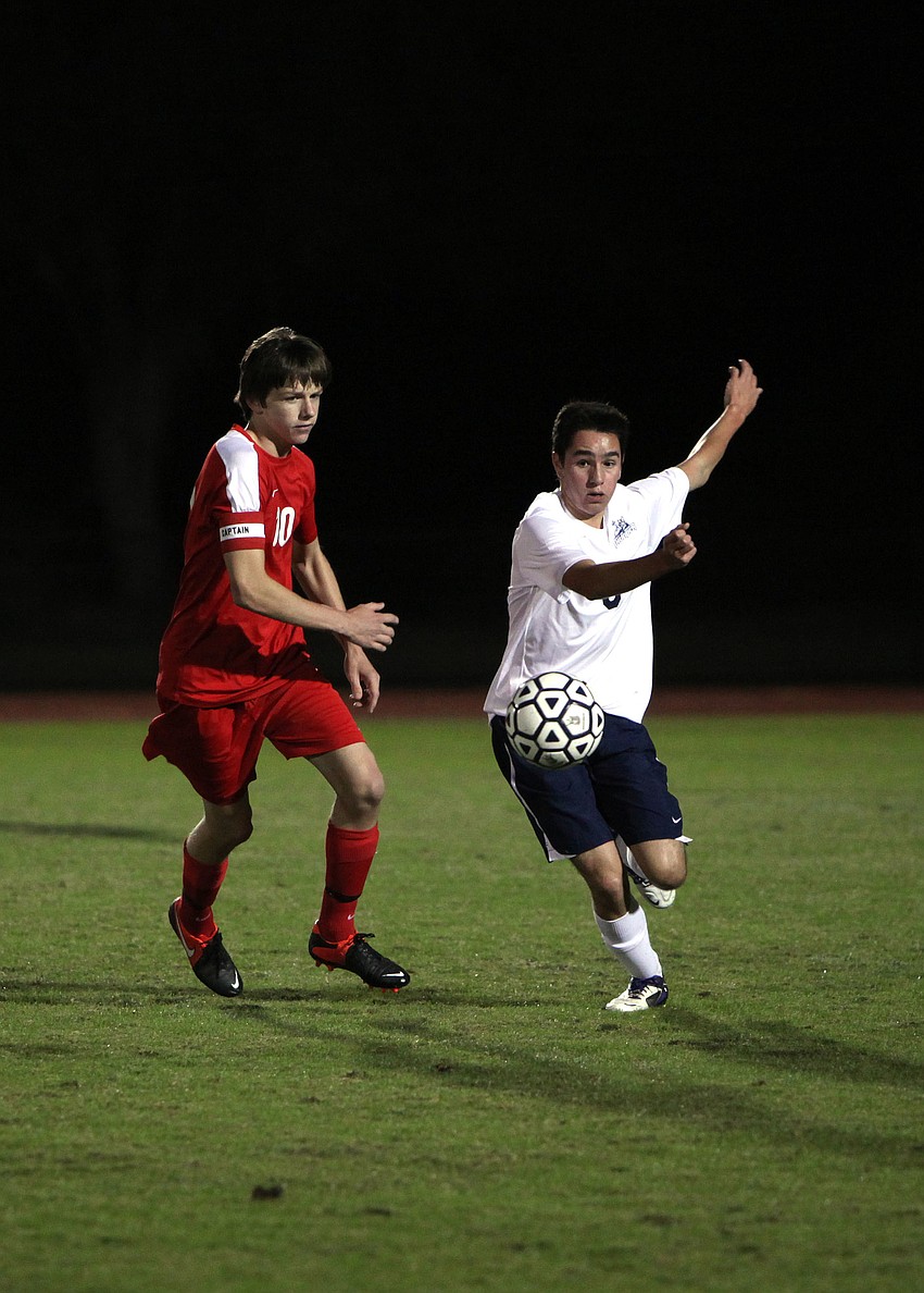 Cardinal Mooneyâ€™s Greg Illig, No. 10, tries to stop ODAâ€™s Alvaro Gonzales, No. 3, from kicking the ball to one of his teammates.