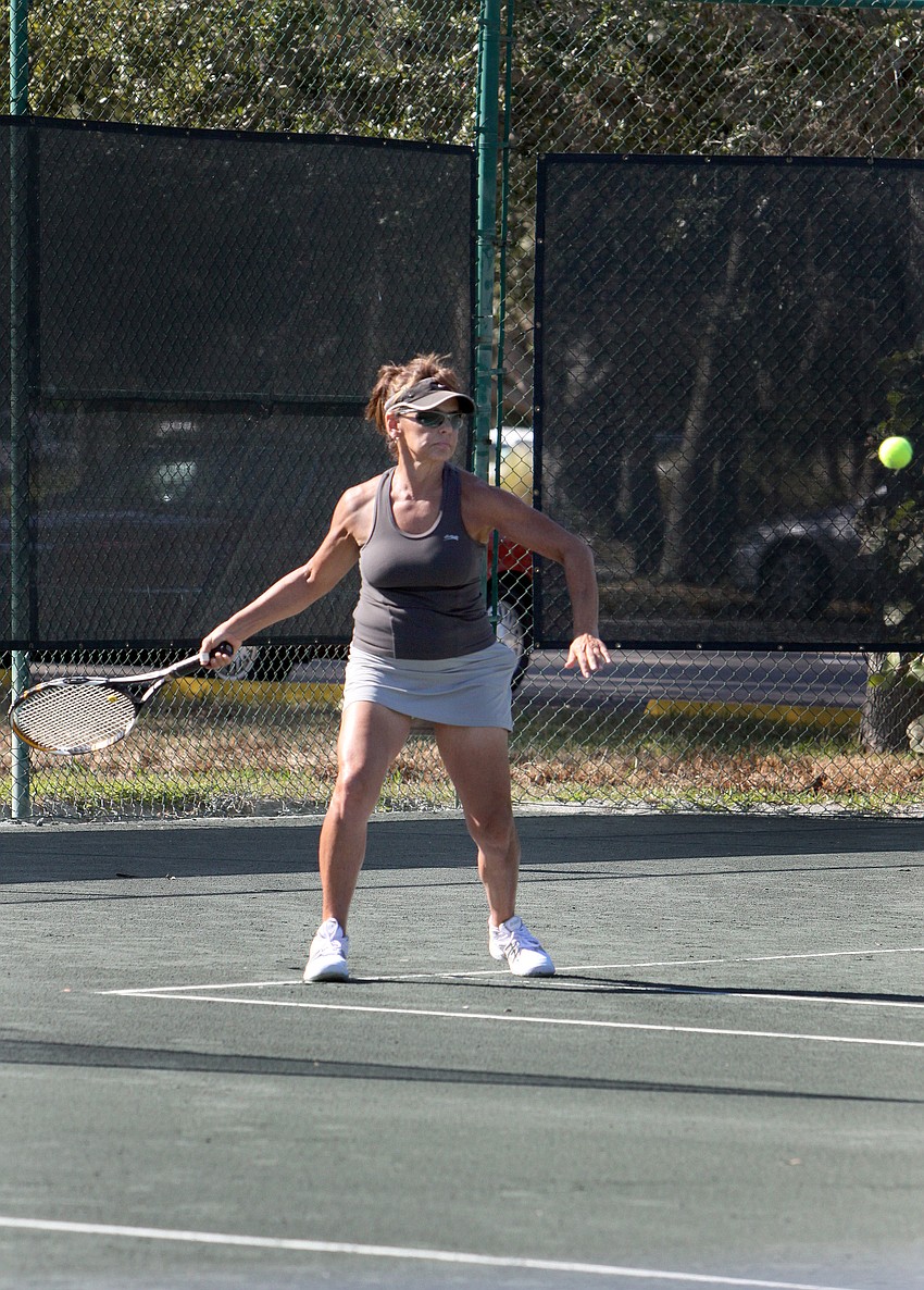 Suzie Singer prepares to hit a forehand during her doubles match Friday, Dec. 7, at the Longboat Key Public Tennis Center