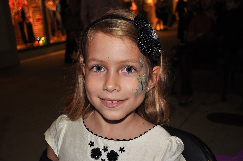 Julianna Regnander, 6, had a butterfly painted on her face Friday, Dec. 7, at the Holiday Night of Lights on St. Armands Circle.