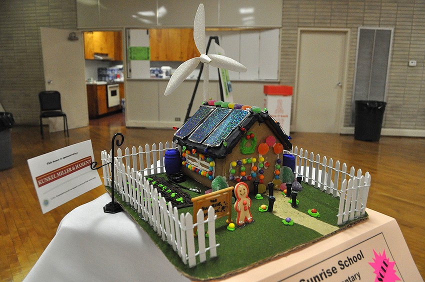 The gingerbread house made by Sunrise Elementary School featured solar panels on the roof and a windmill.