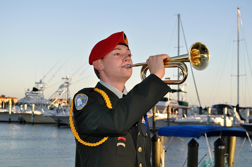 Cadet Wildermuth plays the bugle during the Change of Watch ceremony Saturday, Oct. 20, at the Sarasota Yacht Club.