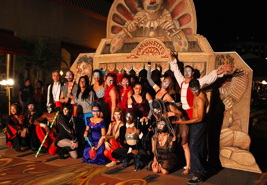 Fuzion Dance poses for photos following their production of â€œ3-DANCEâ€ Monday, Nov. 5, on Kurt Wennerâ€™s chalk piece.