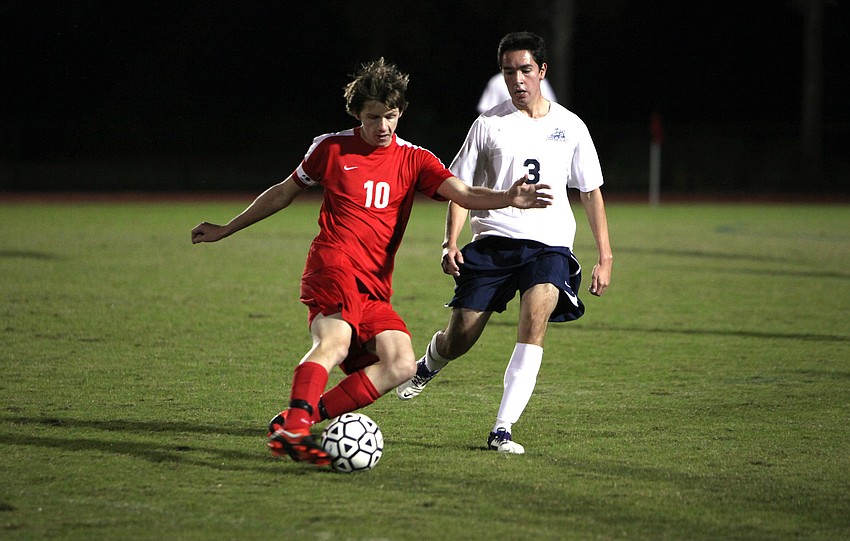 Cardinal Mooney's Greg Illig, No. 10, tries to keep the ball away from ODA's Alvaro Gonzalez, No. 3.