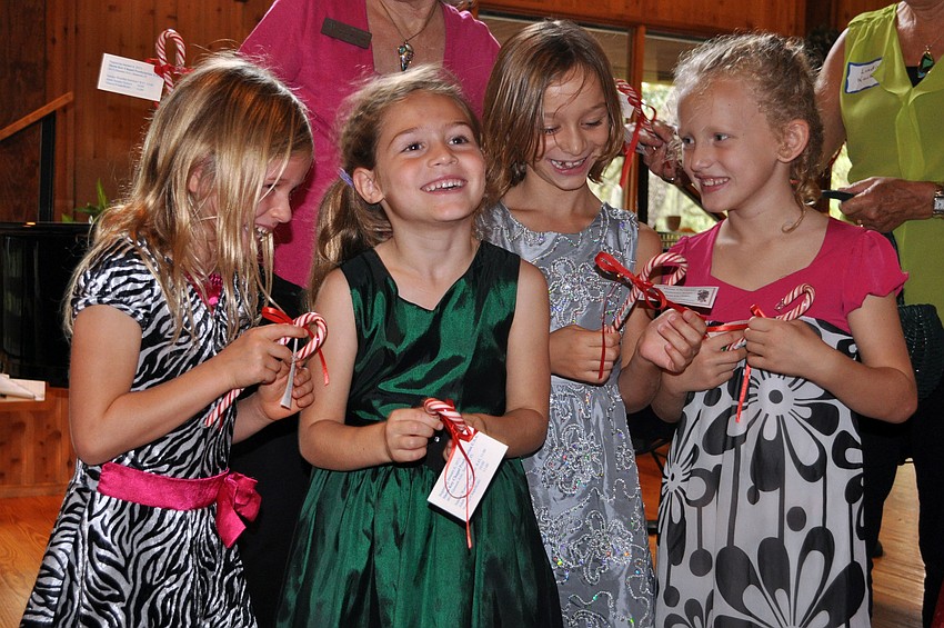 Katy Fulton, Esabella Lerario, Maria Shaw and Claire Giraud get excited about being given candy canes following their performance.